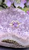 bague en or rose centrée d'une amethyste facettée entourée des oxydes or 375 millième (9 ct) 2,51g