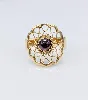 bague fleur motifs vidés centrée d'une pierre de grenat en cabochon or 750 millième (18 ct) 2,30g