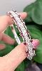 bracelet jonc ouvrant orné de 16 rubis ovale et des lignes de diamants d'environ 2,8ct au total  or 750 millième (18 ct) 34,86g