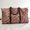 sac de voyage bowling christian dior vintage en tissu jacquard dior oblique et cuir couleur bordeau