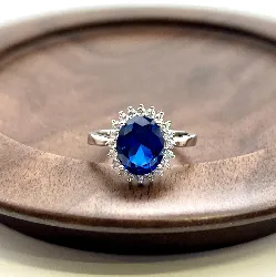 1930040 bague marguerite centrée d'une pierre bleue entourée d'oxydes t54 argent 925 millième (22 ct) 3g argent 925 millième (22 c