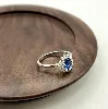 1930340 bague marguerite centrée d'une pierre bleue entourée d'oxydes t52 argent 925 millième (22 ct) 2,13g argent 925 millième (2