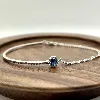 87394118 bracelet orné d'une pierre bleue et entourée d'oxydes l18 cm argent 925 millième (22 ct) 3,9g argent 925 millième (22 ct)