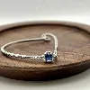 87394118 bracelet orné d'une pierre bleue et entourée d'oxydes l18 cm argent 925 millième (22 ct) 3,9g argent 925 millième (22 ct)
