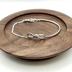 87407218 bracelet demi jonc motif infini orné d'oxydes l18 cm argent 925 millième (22 ct) 4,07g