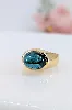 bague bombée sertie d'une tourmallne bleue en cabochon or 750 millième (18 ct) 6,31g