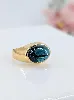 bague bombée sertie d'une tourmallne bleue en cabochon or 750 millième (18 ct) 6,31g