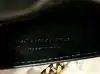 sac à chaîne yves saint laurent kate en cuir noir embossé crocodile, édition spéciale noël 2023