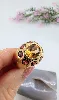 bague bandeau centrée d'une citrine entourée des pierres de grenat or 750 millième (18 ct) 11,60g