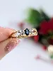bague en 2 ors centrée d'un saphir épaulé de 2 petits diamants or 750 millième (18 ct) 1,90g