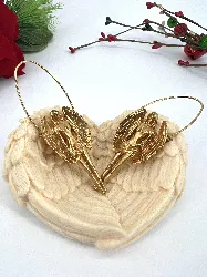 boucles d'oreilles givenchy sculpturales en métal doré collection zodiaque vierge