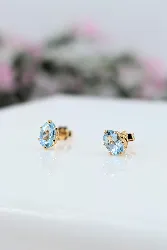 boucles d'oreilles puces chacune sertie d'une topaze or 750 millième (18 ct) 0,85g
