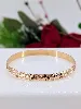 bracelet jonc motifs végétaux or 750 millième (18 ct) 14,05g