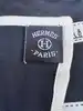 foulard hermès bolduc en jersey de soie blanc et noir avec une certaine élasticité version 2009
