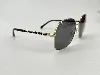 lunettes chanel polarized avec monture couleur doré clair et verres gris