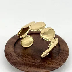 31223064 bracelet jonc ouvert vague motif disques ovales en acier doré larguer 3 cm