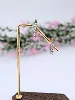 boucles d'oreilles en clips en 2 ors chacune sertie de 7 diamants d'environ 0,7ct au total or 750 millième (18 ct) 4,28g