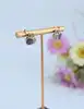 boucles d'oreilles en or blanc avec des pavages de diamants blancs, noires et citrine or 750 millième (18 ct) 5,47g