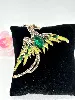 broche phénix en métal doré clair et émaillé ornée des strass blancs et vert