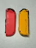 paire de joycon orange et rouge