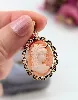 pendentif en or rose centré d'une camée coquillage avec profile d'une dame or 750 millième (18 ct) 2,20g