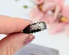 bague jeell en céramique noir centrée d'un motif en or blanc pavé de petits diamants or 750 millième (18 ct) 4,93g
