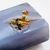 bague les néréides en forme de serpent et fleurs avec pierres orange et rouge