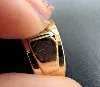 bague tank sertie un diamants d'environ 0,10ct et une ligne de ornée de rubis synthétiques taille baguettes or 750 millième (18 ct