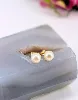 boucles d'oreilles chacune ornée d'une perle de culture or 750 millième (18 ct) 1,53g