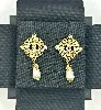 boucles d'oreilles chanel cc pendantes perles synthétiques et métal doré