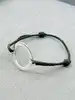 bracelet cordon en cuir marron avec une breloque cercle en argent argent autre 3,73g