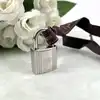 cadenas hermès argenté avec 2 clès