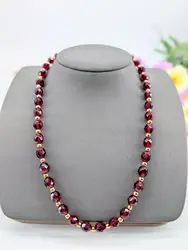 collier maille forçat en or orné des boules de grenats facettées alternés des billes en or or 750 millième (18 ct) 26,74g