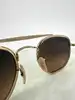 lunettes de soleil ray-ban rb3648-m the marshal ii monture en métal doré et verres morron dégradé