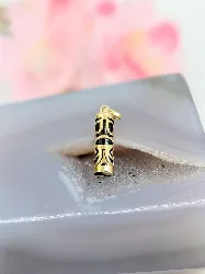 pendentif tiki en or et bois noir or 750 millième (18 ct) 0,9g