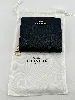 portefeuille coach à bouton pression en cuir noir