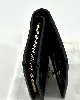 portefeuille coach à bouton pression en cuir noir
