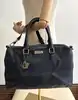 sac à main versace collection en cuir grainé souple bleu marine avec bandoulière réglable et amovible