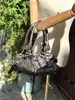 sac chloé paddington en cuir couleur métallisé bronze avec détails argentés