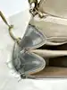 sac christian dior diorama vertical à chaîne en cuir verni métallisé argenté et clous dorés