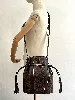 sac seau lancel en cuir marron modèle elsa sellier avec porte monnaie