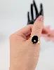 bague chevalière onyx sertie d'un diamant d'environ 0,02cts or 750 millième (18 ct) 4,94g