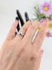 bague pastille en or blanc avec une pavage de petits diamants épaulée d'une ligne de diamants or 375 millième (9 ct) 1,67g