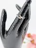 bague rubans croisés en or blanc sertie de petits diamants noirs et blancs or 585 millième (14 ct) 1,28g