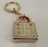 bijou de sac/porte-clés christian dior lady dior en métal doré, motif cannage