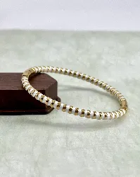 brac bracelet jonc en acier doré et émail blanc