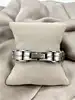 bracelet en acier bicolore noir et câble