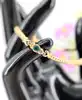 bracelet maille haricot plate serti de 3 émeraudes or 750 millième (18 ct) 6,65g