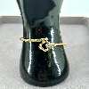 bracelet / manchette motif fleur en acier doré