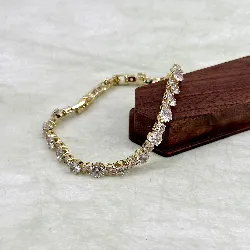 bracelet rivière serti d'oxydes en acier doré l16 /19 cm